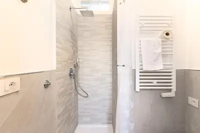 a bathroom with a shower and a toilet at Vatican Cipro Guest House in Rome