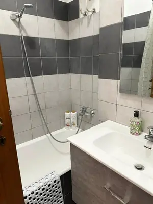a bathroom with a shower and a sink and a tub at Cute apartment next to vatican in Rome