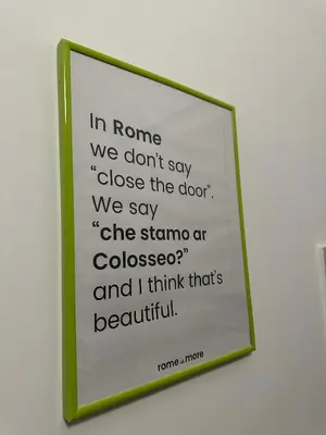 a framed sign on a wall with a quote at Cute apartment next to vatican in Rome
