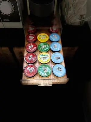 a group of different colored plates in a drawer at Antoni House San Giovanni in Rome