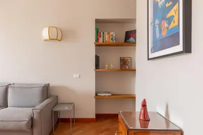 a living room with a couch and a table at HospitalityRome Doninzetti 20 in Rome