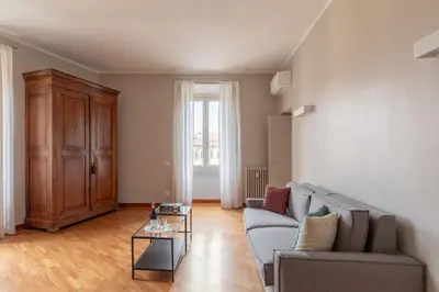 a living room with a couch and a table at HospitalityRome Doninzetti 20 in Rome