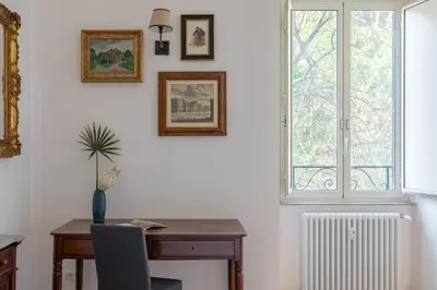 an office with a desk and a window at iFlat Charming & Spacious Flat in Trastevere in Rome