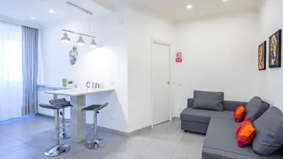 a living room with a couch and a table at EasyTopStay - Stylish Vatican Retreat in Rome