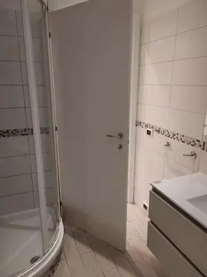 a bathroom with a shower and a sink at Garbatella seminterrato in Rome