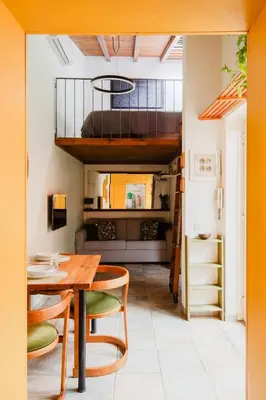 a dining room with a table and a loft at Casa Piccinino in Rome