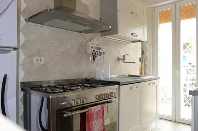 a kitchen with a stainless steel stove top oven at Locazione turistica di Carlo in Rome
