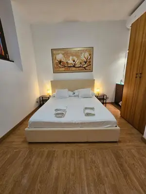 a bedroom with a large white bed in a room at Private SPA Apartment in Rome in Rome