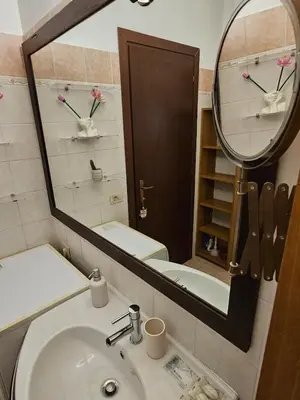 a bathroom with a sink and a mirror at Private SPA Apartment in Rome in Rome