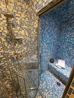 a bathroom with a glass shower with a toilet at Private SPA Apartment in Rome in Rome