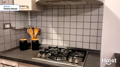 a kitchen counter with a stove top in a kitchen at Poetry House in Rome