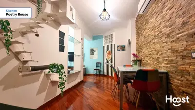 a hallway with a table and a brick wall at Poetry House in Rome