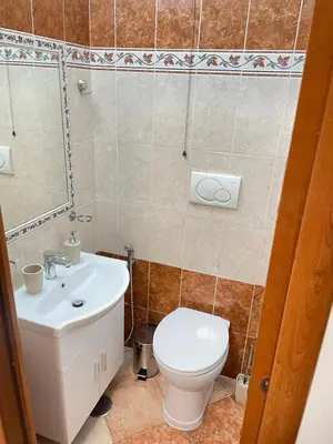 a bathroom with a toilet and a sink at Residenza Abat-Jour de Rome in Rome