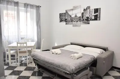 a bedroom with a bed with two pillows on it at Metro Battistini- D'Alessandro Holiday Home in Rome