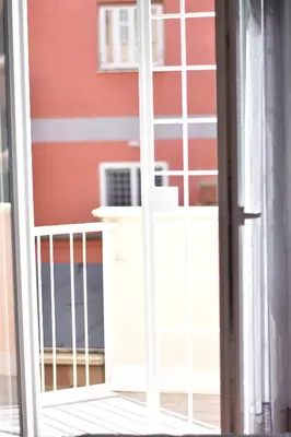 an open door to a balcony with an air conditioner at Metro Battistini- D'Alessandro Holiday Home in Rome