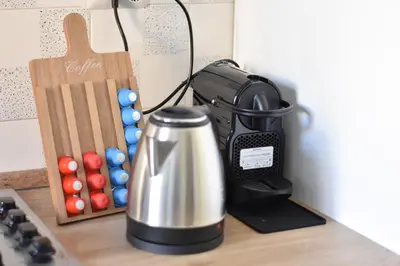 a kitchen counter with a tea kettle on a stove at Metro Battistini- D'Alessandro Holiday Home in Rome