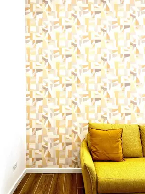 a yellow couch in a living room with a wall at The Temple Apartment in Rome