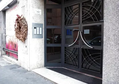 a front door of a building with a large window at Thery House - Tiburtina Apartment in Rome