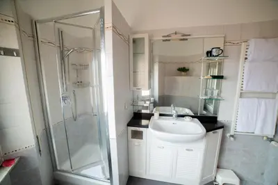 a bathroom with a sink and a shower at casa di Nadia in Rome
