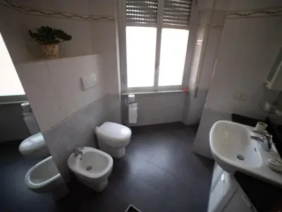 a bathroom with a toilet and a sink at casa di Nadia in Rome