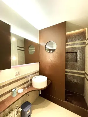 a bathroom with a sink and a mirror at Di casa al Colosseo in Rome
