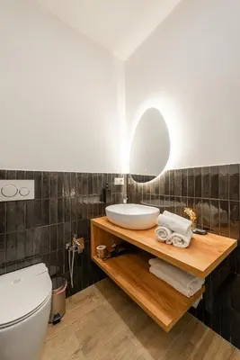 a bathroom with a sink and a mirror at Ventuno Dei Luxury Suites San Giovanni in Rome
