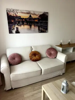 a living room with a couch with pillows on it at CAFE Portonaccio apartment in Rome