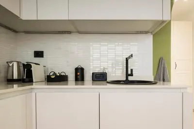 a kitchen with a counter top with a sink at Trastevere Luxury Studio in Rome