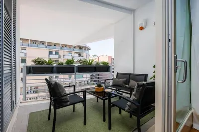 a balcony with a table and chairs on a balcony at Trastevere Luxury Studio in Rome