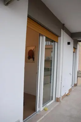 a room with sliding glass doors in a building at Casa Sisto in Rome