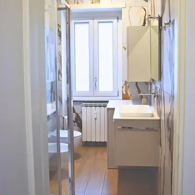 a bathroom with a sink and a window at Casa Sisto in Rome