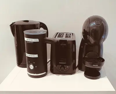 a group of appliances sitting on a shelf at SUITE56Roma in Rome