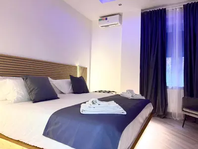 a hotel room with a bed with a towel on it at SUITE56Roma in Rome