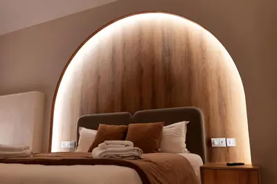 a bedroom with a large bed with a wooden headboard at HeySuite Classic - Luxury House - Navona in Rome