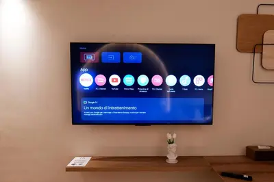 a flat screen tv hanging on a wall at HeySuite Classic - Luxury House - Navona in Rome
