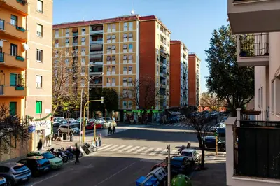a view of a city street with cars and buildings at La casetta di Trastevere in Rome