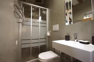 a bathroom with a toilet and a sink and a shower at Il Nido sui Tetti di Piazza Navona in Rome