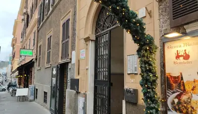 a building with a christmasreath on the side of a street at Vatican Luxury Duplex in Rome