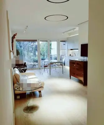 a living room with a couch and a table at Exceptional near Vatican flat with swimming pool in Rome