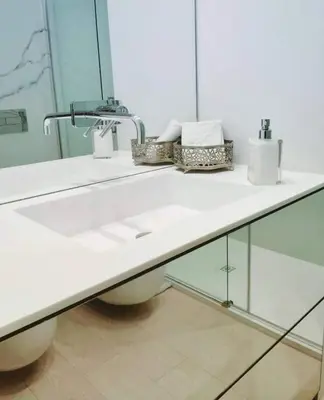 a bathroom with a white sink and a mirror at Exceptional near Vatican flat with swimming pool in Rome