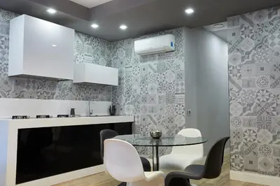 a dining room with a glass table and chairs at Roma Vaticano Deluxe Apartment in Rome