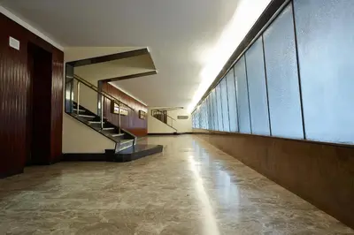 an empty hallway of a building with a staircase at Roma Vaticano Deluxe Apartment in Rome