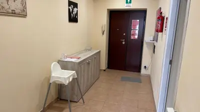a bedroom with a bed with two towels on it at Gemelli House in Rome