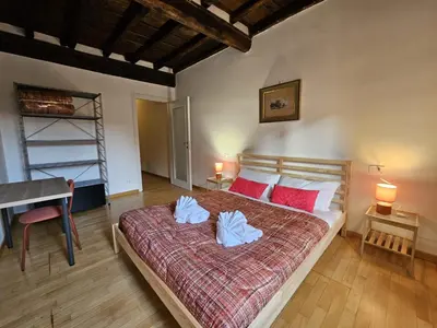 a bedroom with a bed with two pillows on it at Be Your Home - CasAngelica in Rome
