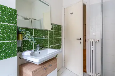a bathroom with a sink and a mirror at iFlat Colosseo Prestige in Rome