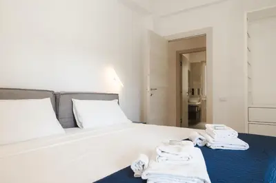 a bedroom with a bed with towels on it at Domus Solis in Rome