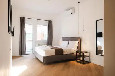 a bedroom with a bed and a large window at Domus Solis in Rome