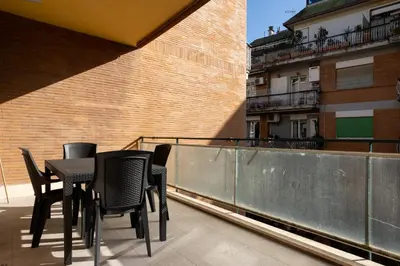 a table and chairs on the balcony of a building at Domus Solis in Rome