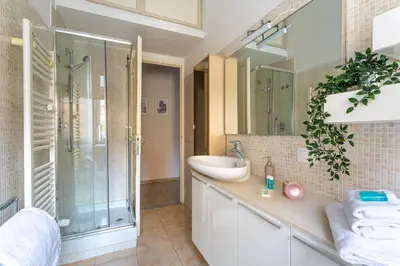 a bathroom with a sink and a shower at iFlat Vatican Bright & Comfortable Apartment in Rome