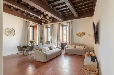 a living room with a couch and a table at iFlat Trastevere Life with Beauty, Elegance & SPA in Rome